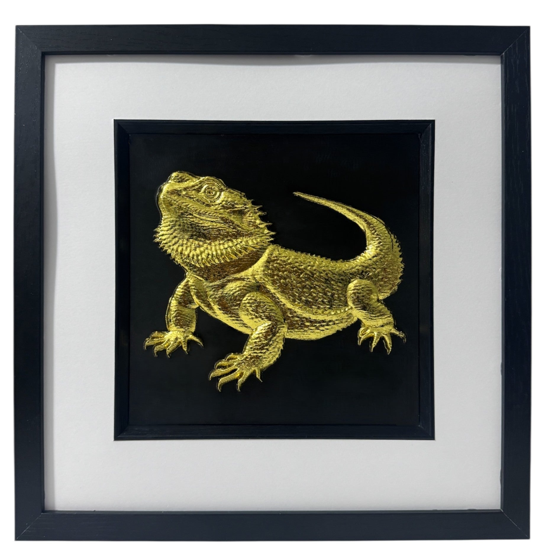 A luxury 3D relief sculpture of a Bearded Dragon finished in metallic gold leaf, presented in a black gallery box frame with a white mount.