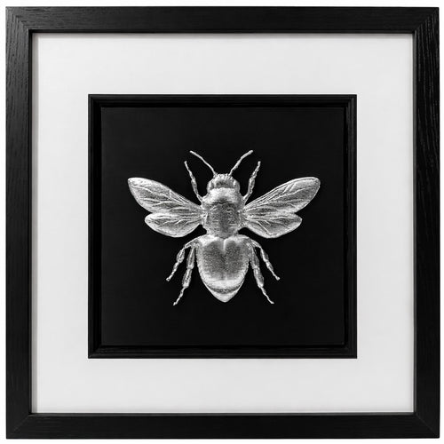 Front-facing silver leaf bumble bee wall art with black background and white mount