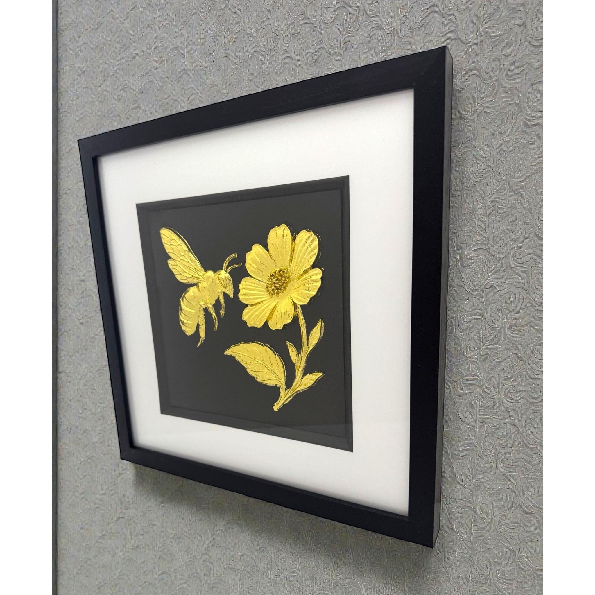 Bee and flower framed wall art displayed on wall