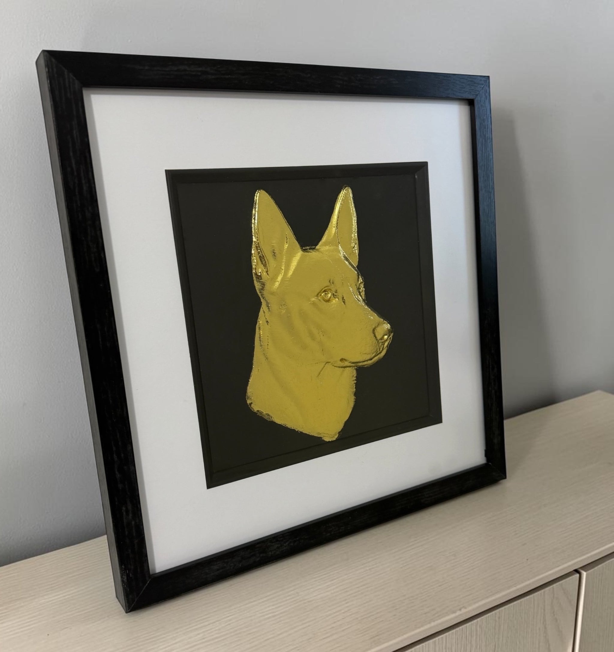 Belgian Malinois framed wall art displayed in a modern interior setting on a light wooden desk