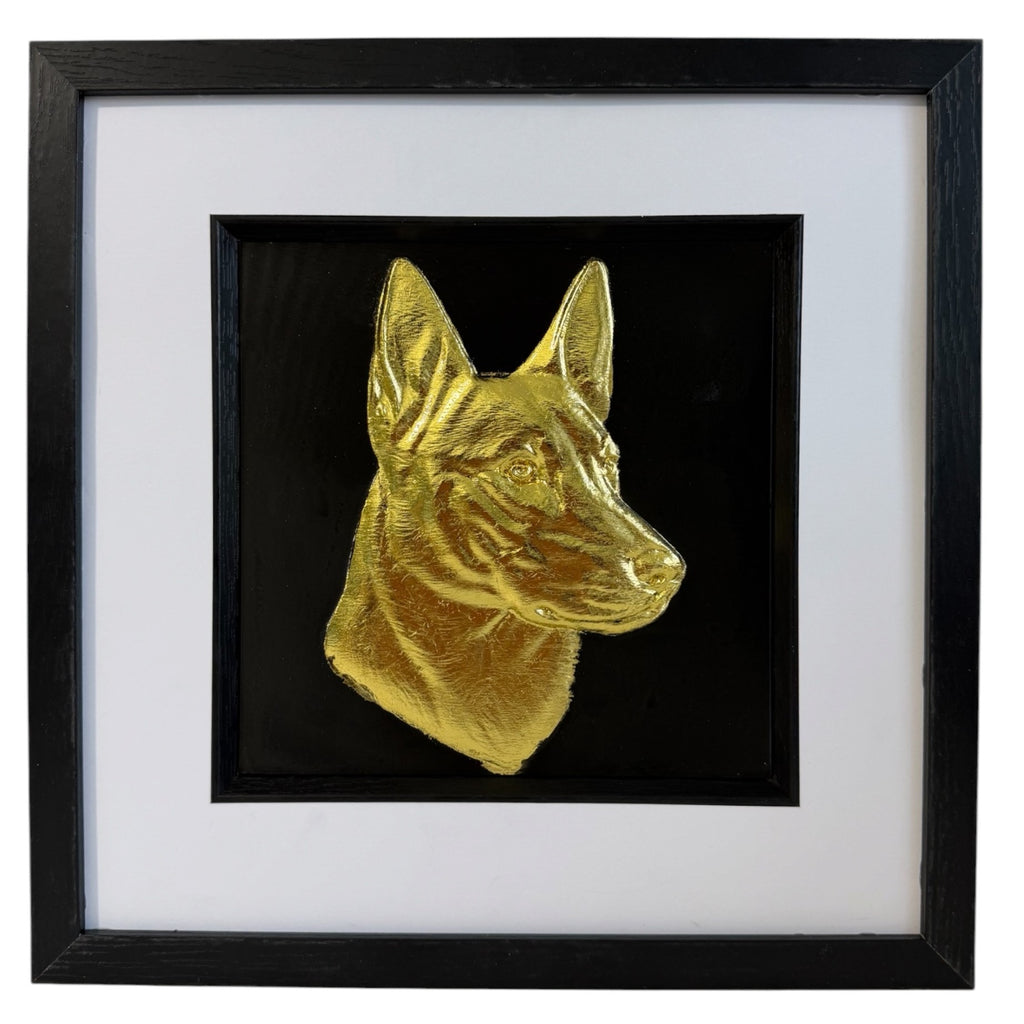 Gold Belgian Malinois framed dog wall art displayed on a black background with a white mount and black frame, designed as a premium pet portrait gift.