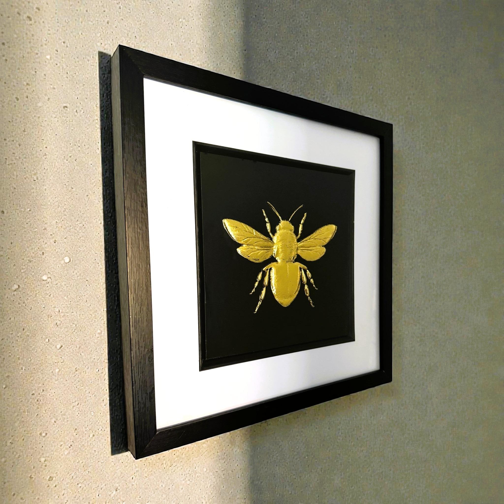 Angled wall-mounted view of bumble bee wall art showing frame depth
