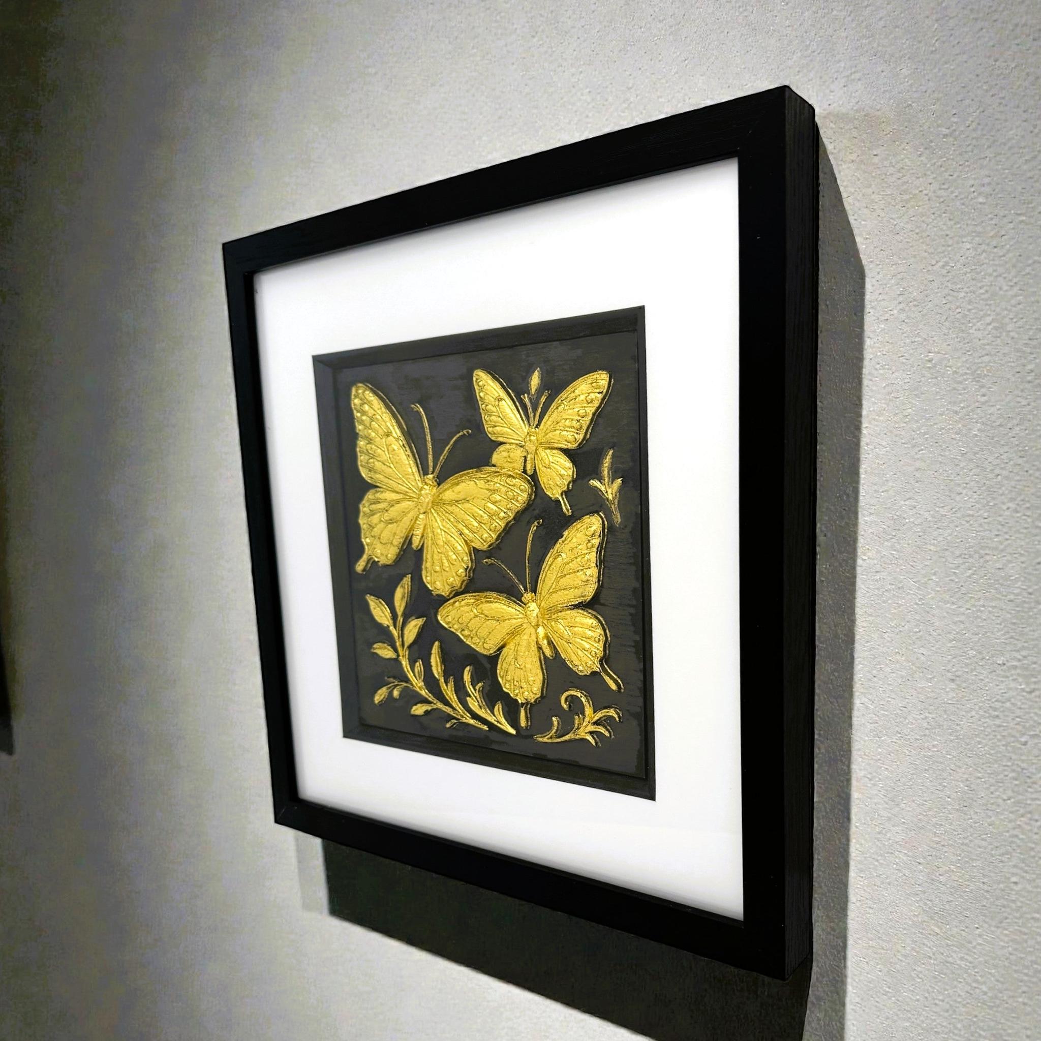 Framed butterfly trio wall art displayed on wall in a calm neutral interior