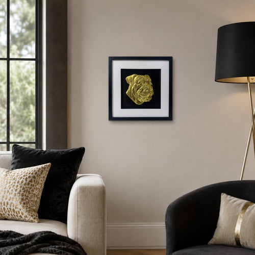 Cane Corso gold leaf framed dog wall art displayed on a warm neutral living room wall with black and gold luxury interior accents.