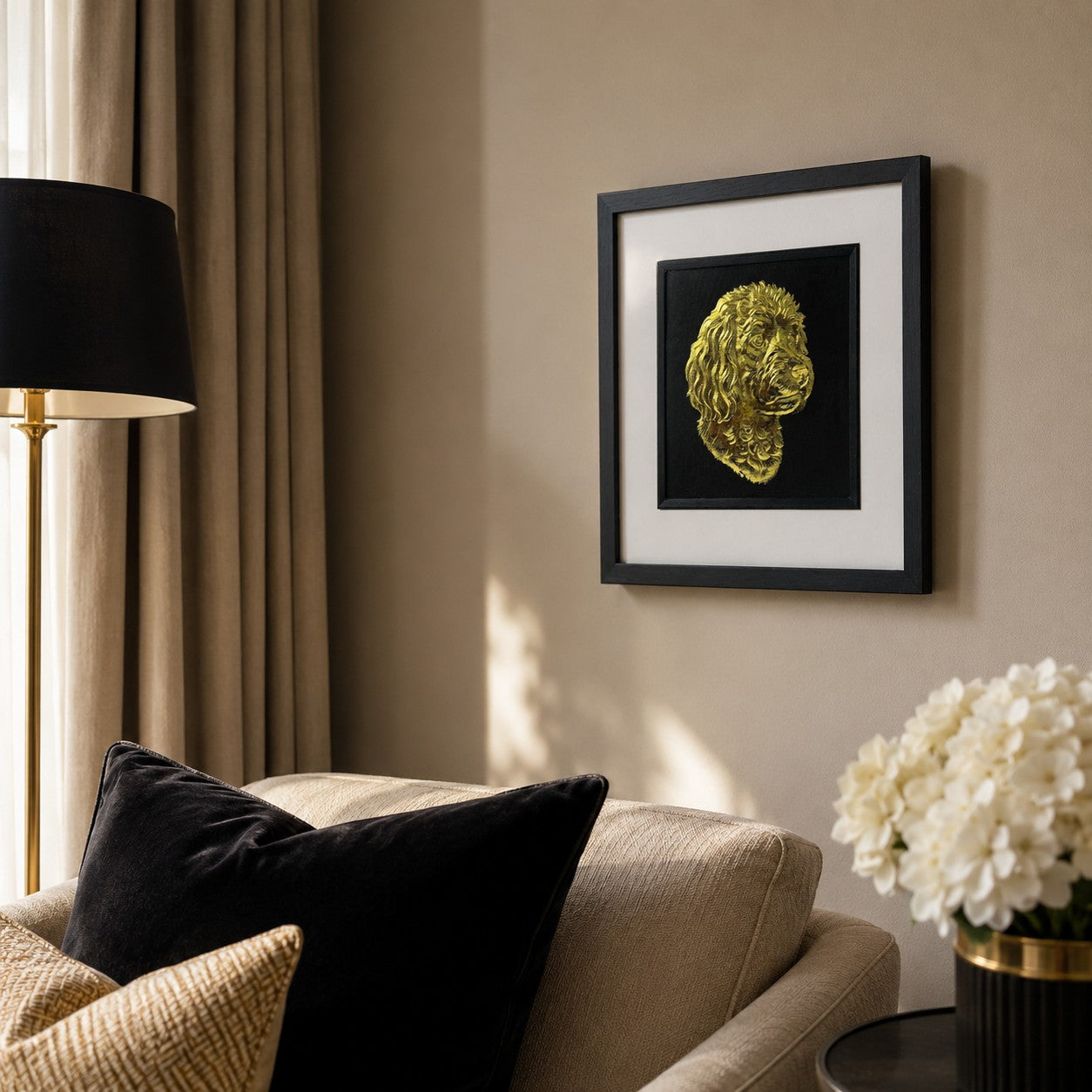 Angled lifestyle view of Cavapoo gold 3D relief dog wall art in a black frame with white mount, styled on a neutral living room wall.