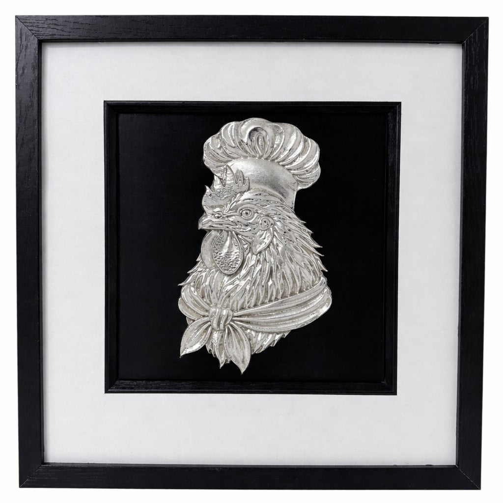 Silver chef rooster relief in a black box frame with wide white mount and black inner surround.