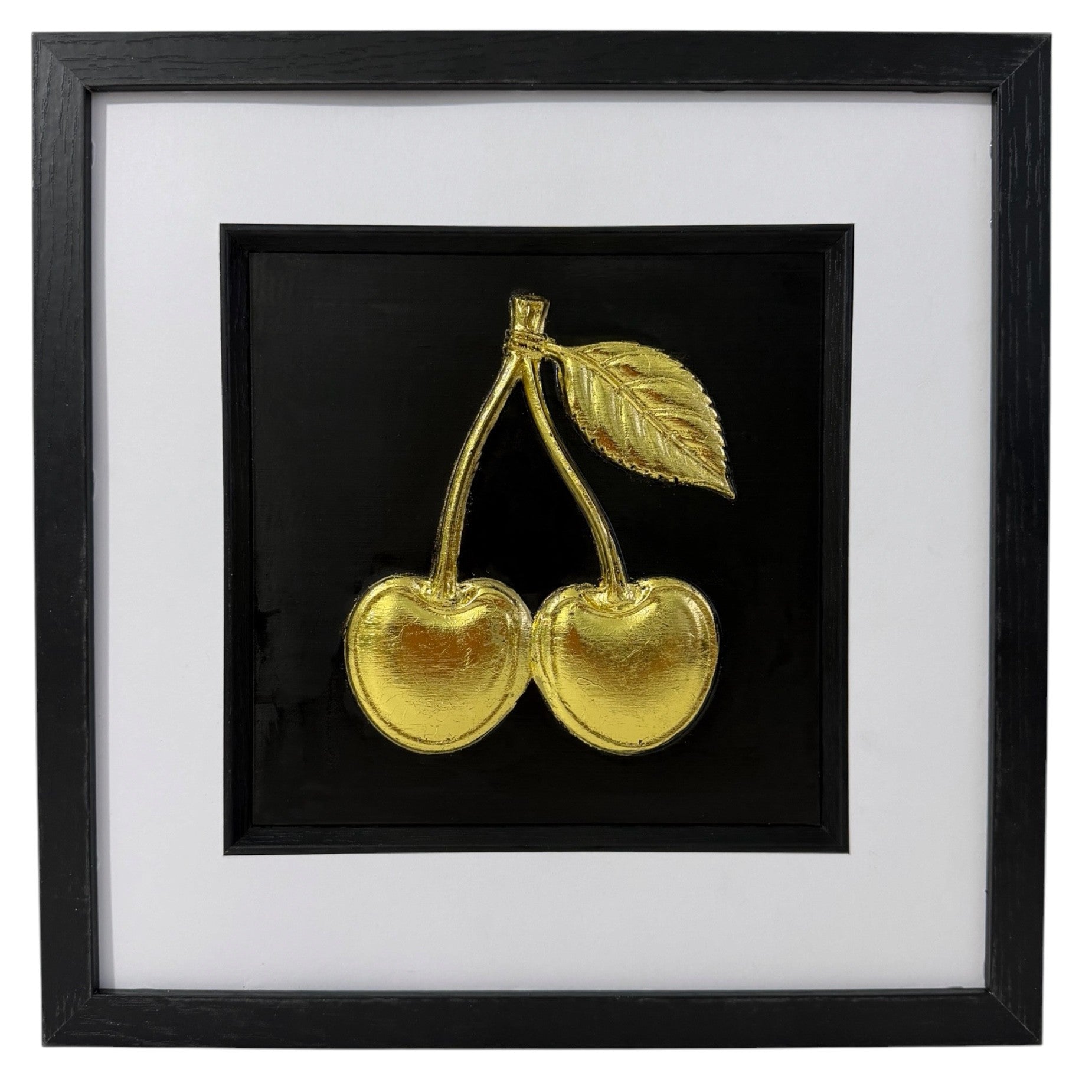Gold cherry framed relief artwork with leaf detail, black inner surround and wide white mount.