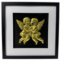Front-facing gold leaf cherubs wall art on a black background within a black wooden frame
