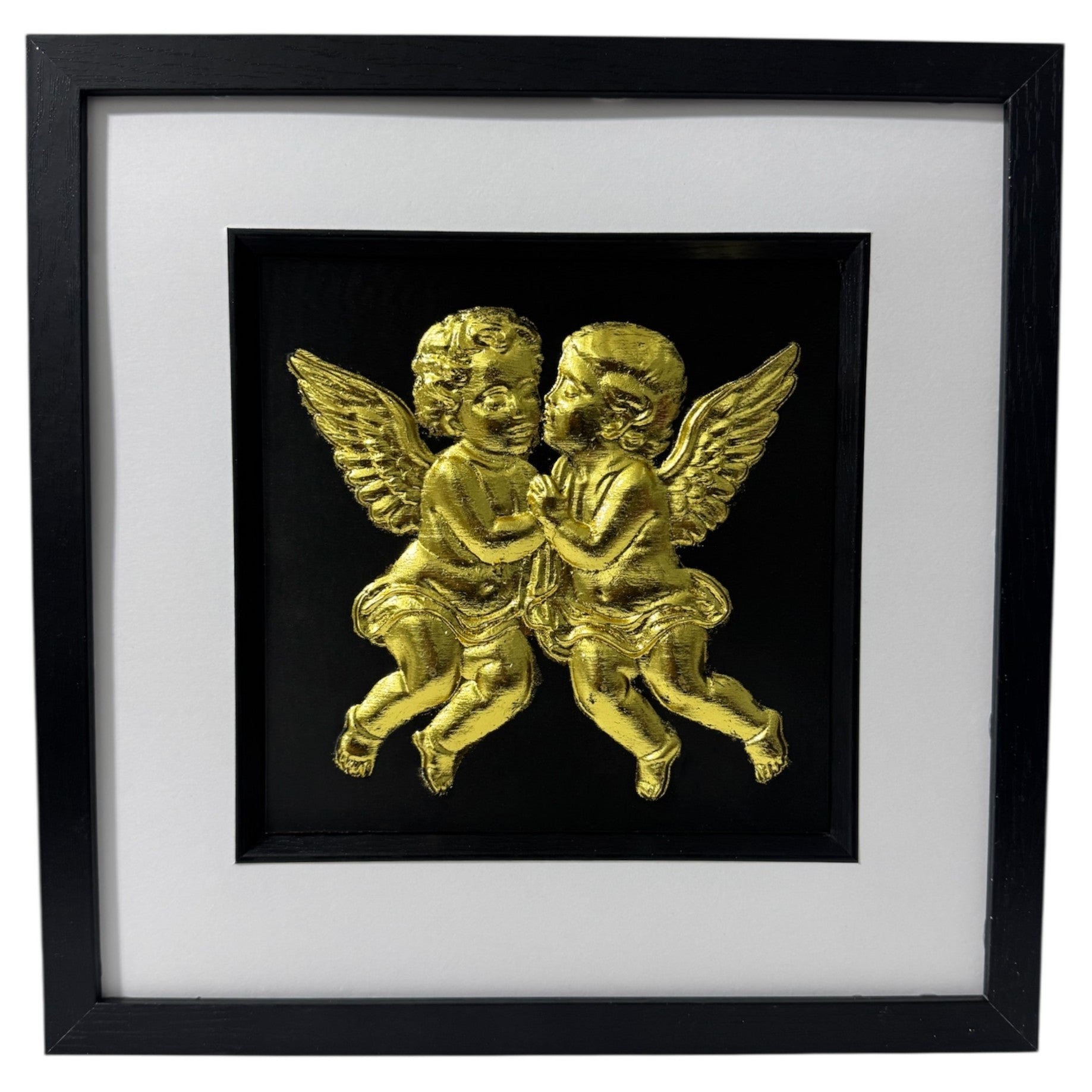 Front-facing gold leaf cherubs wall art on a black background within a black wooden frame