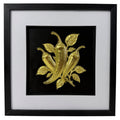 Gold chilli pepper raised relief artwork in a black frame with leafy detail and white mount.