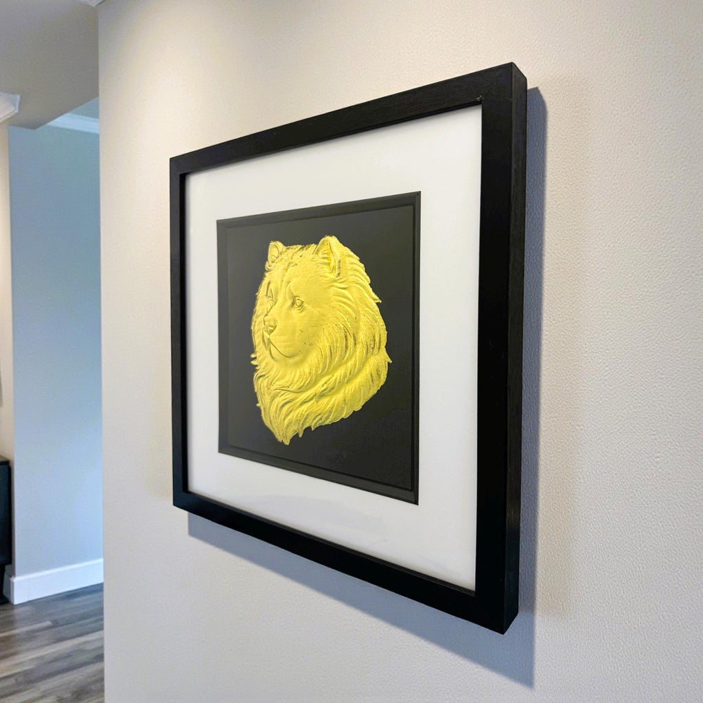 Chow Chow dog wall art in black wooden frame with gold leaf finish mounted to a wall