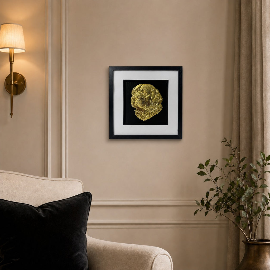 Clumber Spaniel gold leaf framed dog wall art displayed on a warm neutral living room wall with cream, black and gold accents.