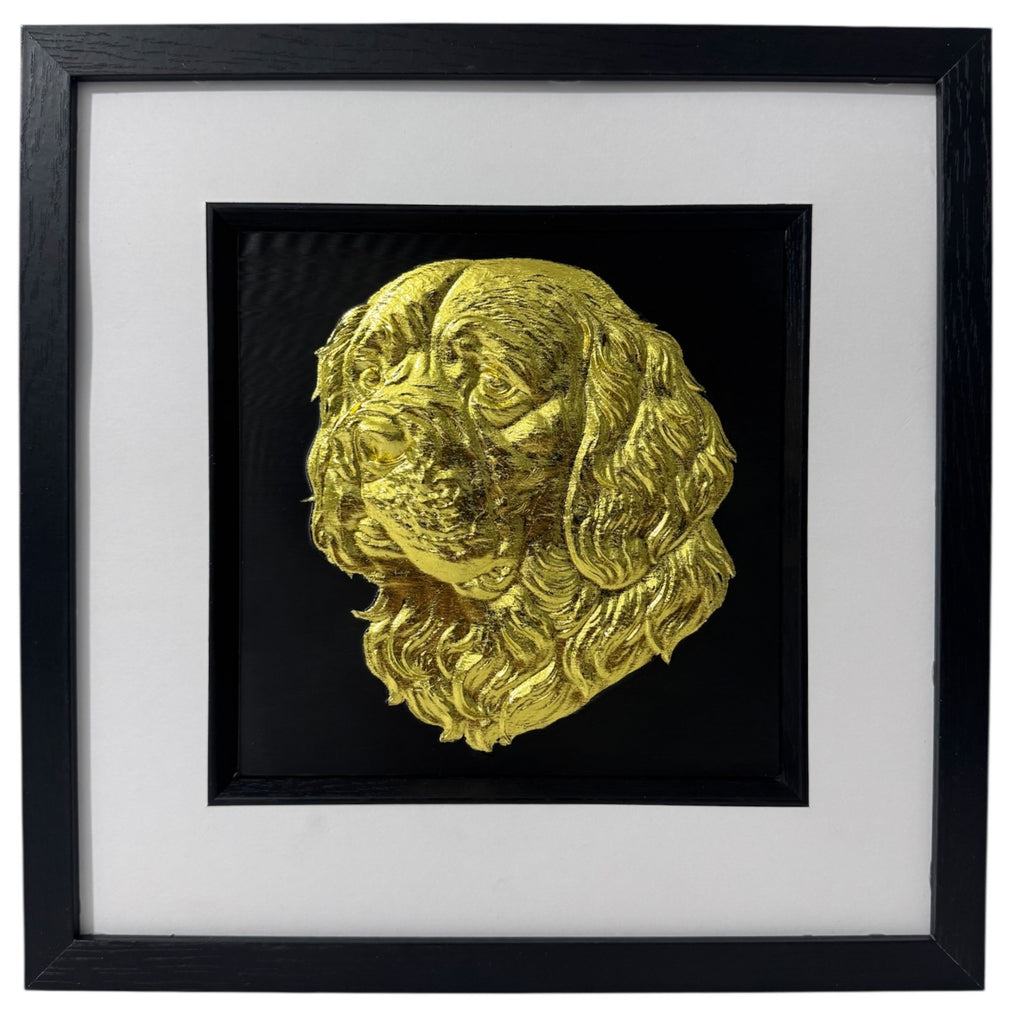 Gold Clumber Spaniel relief portrait in a black box frame with wide white mount and black inner surround.