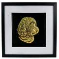 Framed cockapoo wall art with gold relief portrait on a black background, set in a black frame with white mount on a clean white background