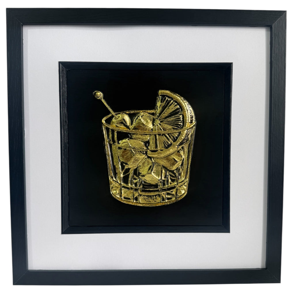 Front view of cocktail glass 3D relief artwork in Gold Leaf on black background with white mount in a black box frame