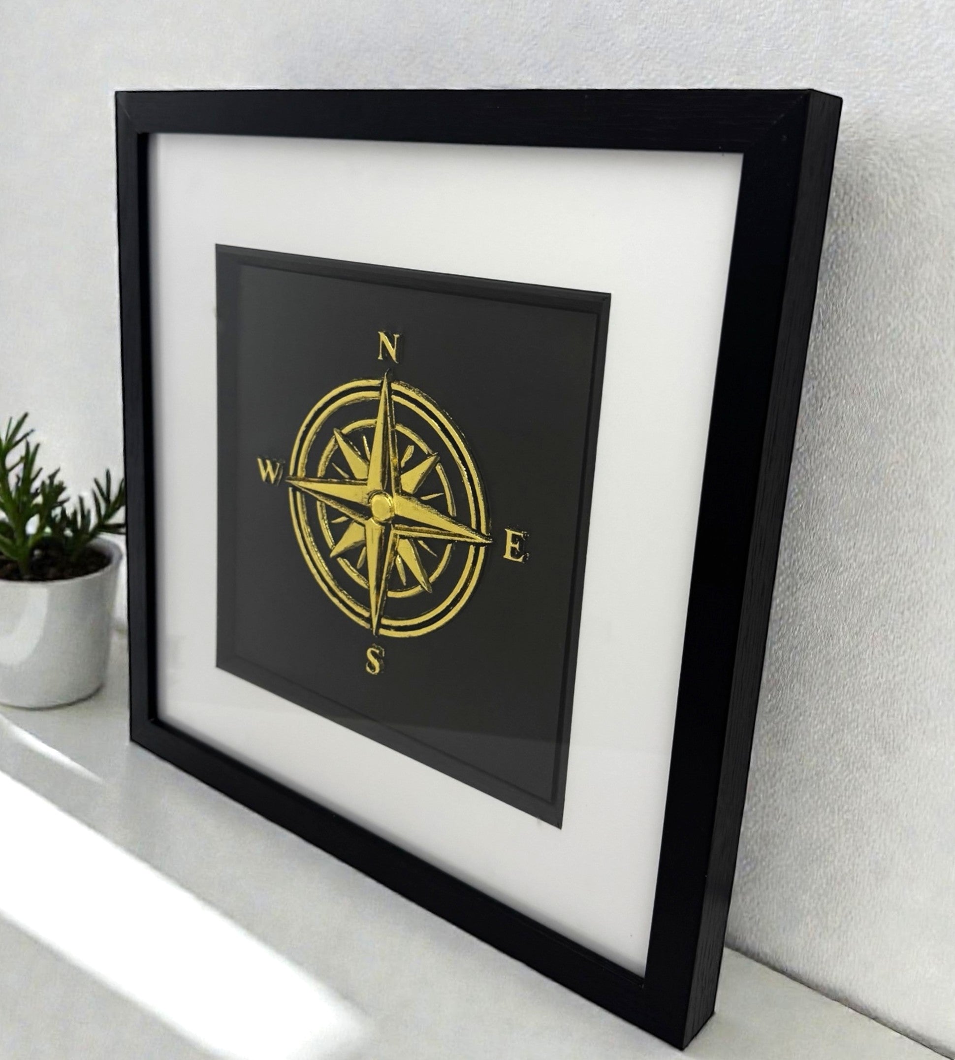 Gold compass wall art styled on a shelf, modern compass rose gift for retirement or bon voyage