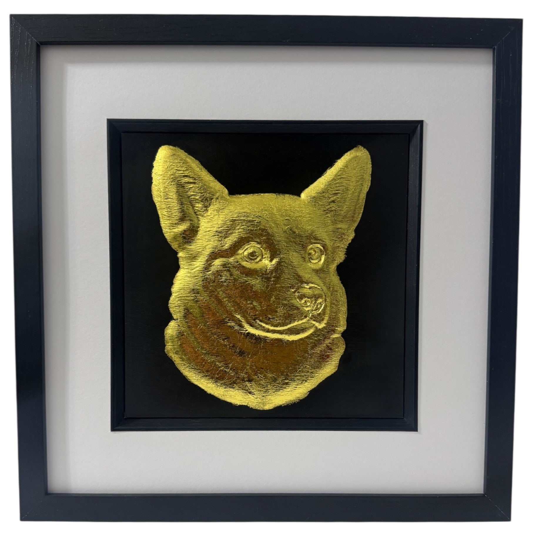 Framed corgi wall art with gold relief portrait on a black background, presented in a black frame with white mount on a pure white background