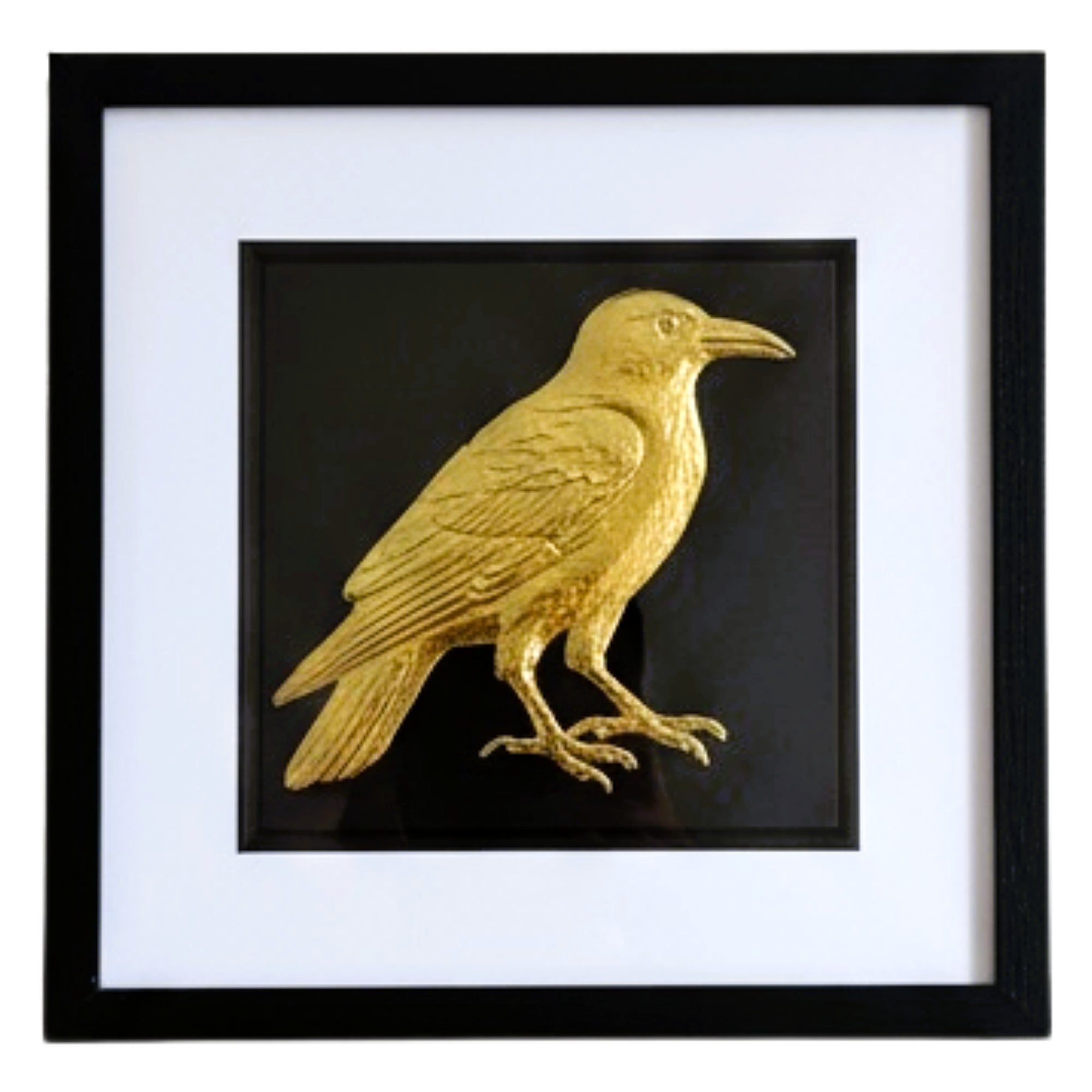 Front-facing gold leaf crow wall art on black background with white mount