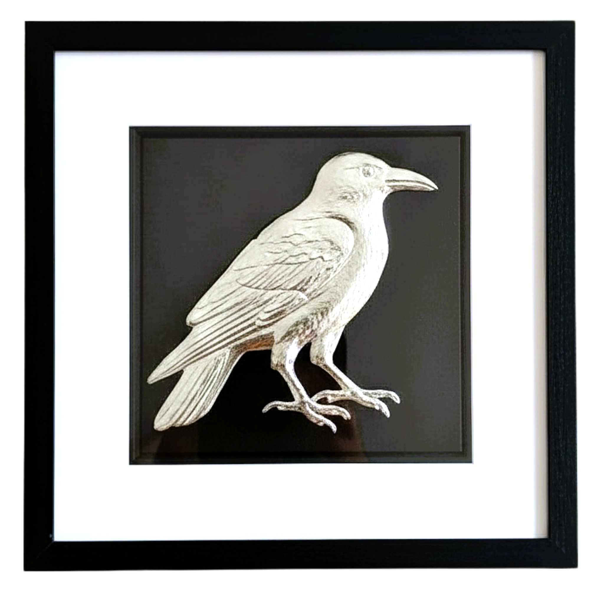 Front-facing silver leaf crow wall art on black background with white mount