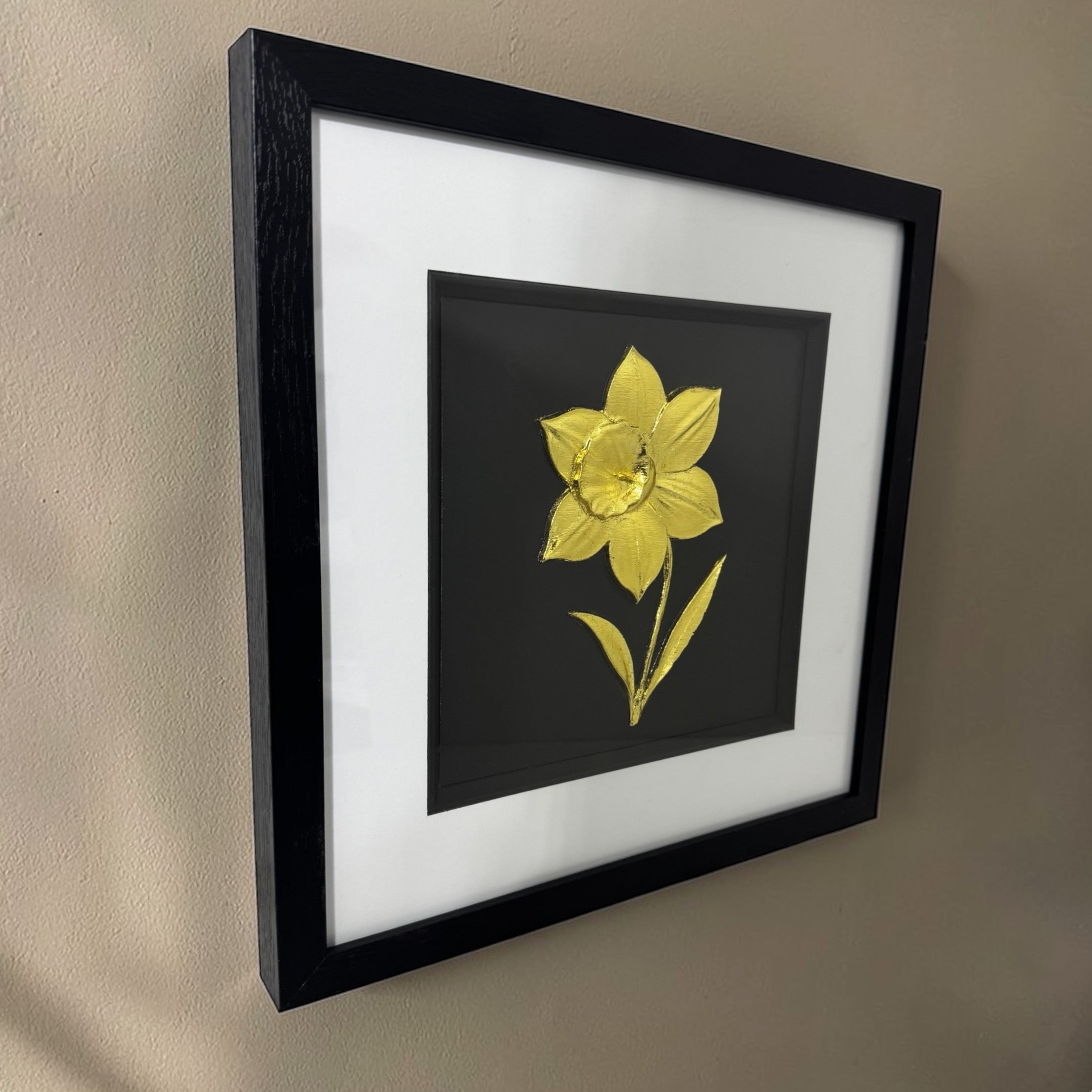 framed daffodil gold 3d wall art side angle view on a beige wall