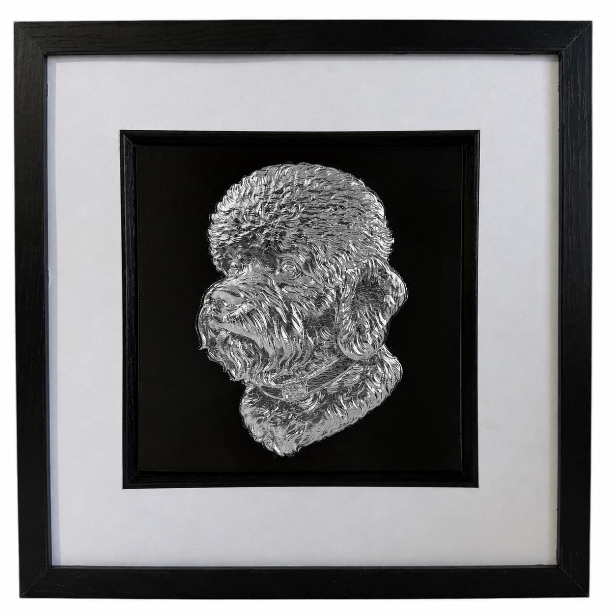 Front view of a silver Dandie Dinmont Terrier relief portrait in a square black frame with a wide white mount and black inner surround.
