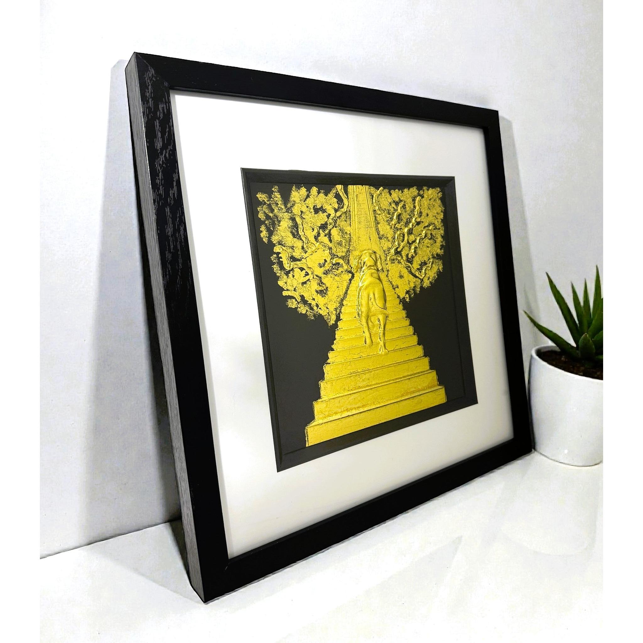 Dog Stairway to Heaven framed wall art shown on desk surface in black frame