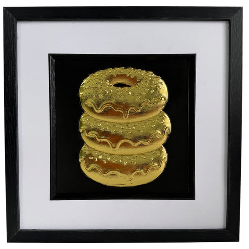 Straight-on Gold doughnut stack relief artwork with black centre panel, white mount and black frame.