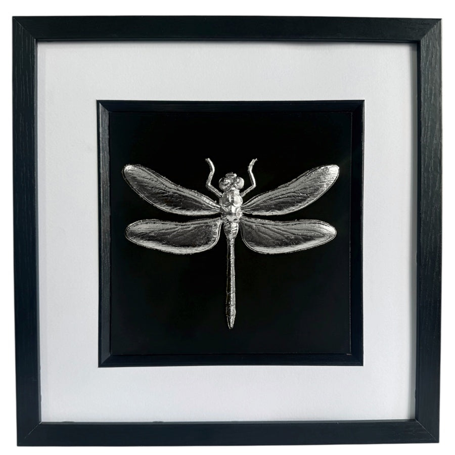 Front-facing silver leaf dragonfly wall art with black background and white mount