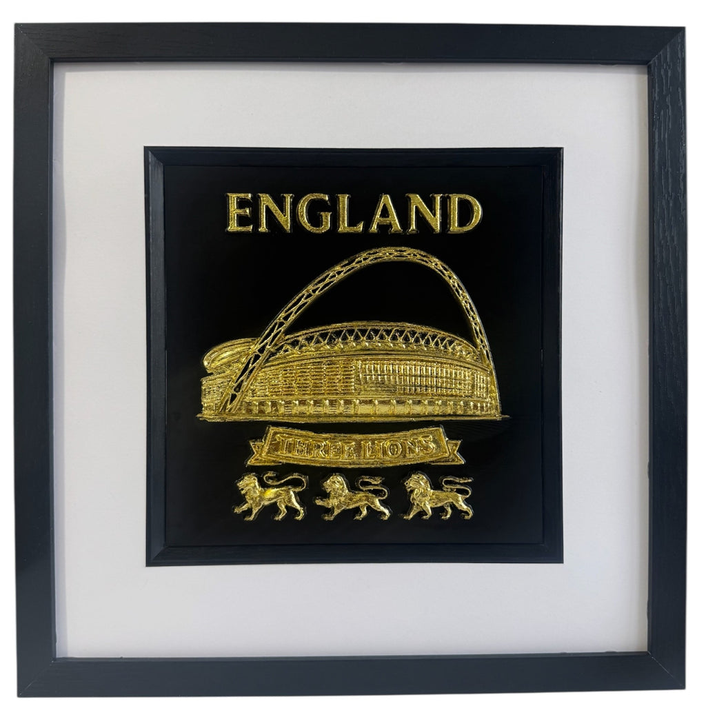 Gold England Wembley Stadium 3D relief artwork with “ENGLAND” text and “THREE LIONS” banner, front view in black frame with white mount