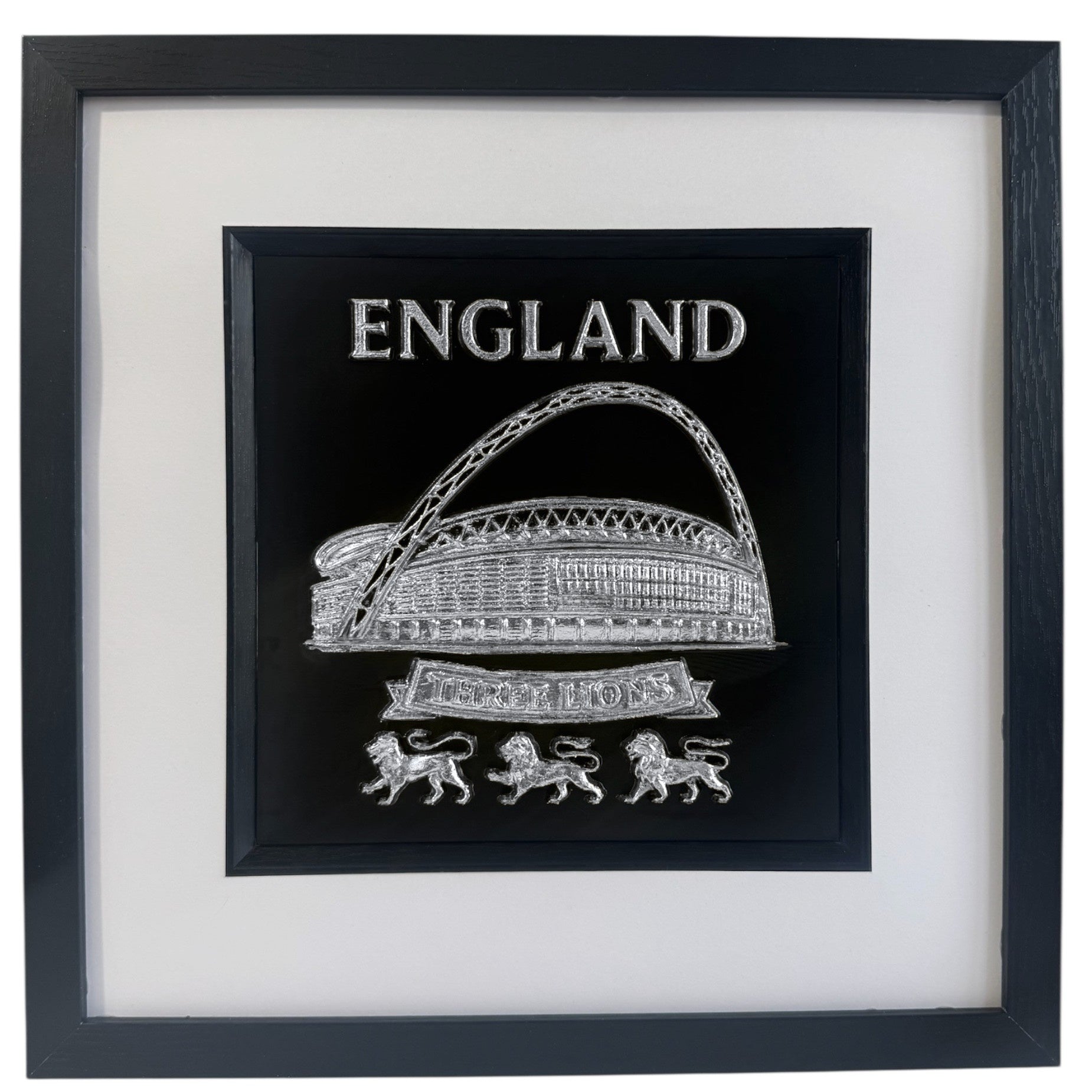 Silver England Wembley Stadium 3D relief artwork with “ENGLAND” text and “THREE LIONS” banner, front view in black frame with white mount