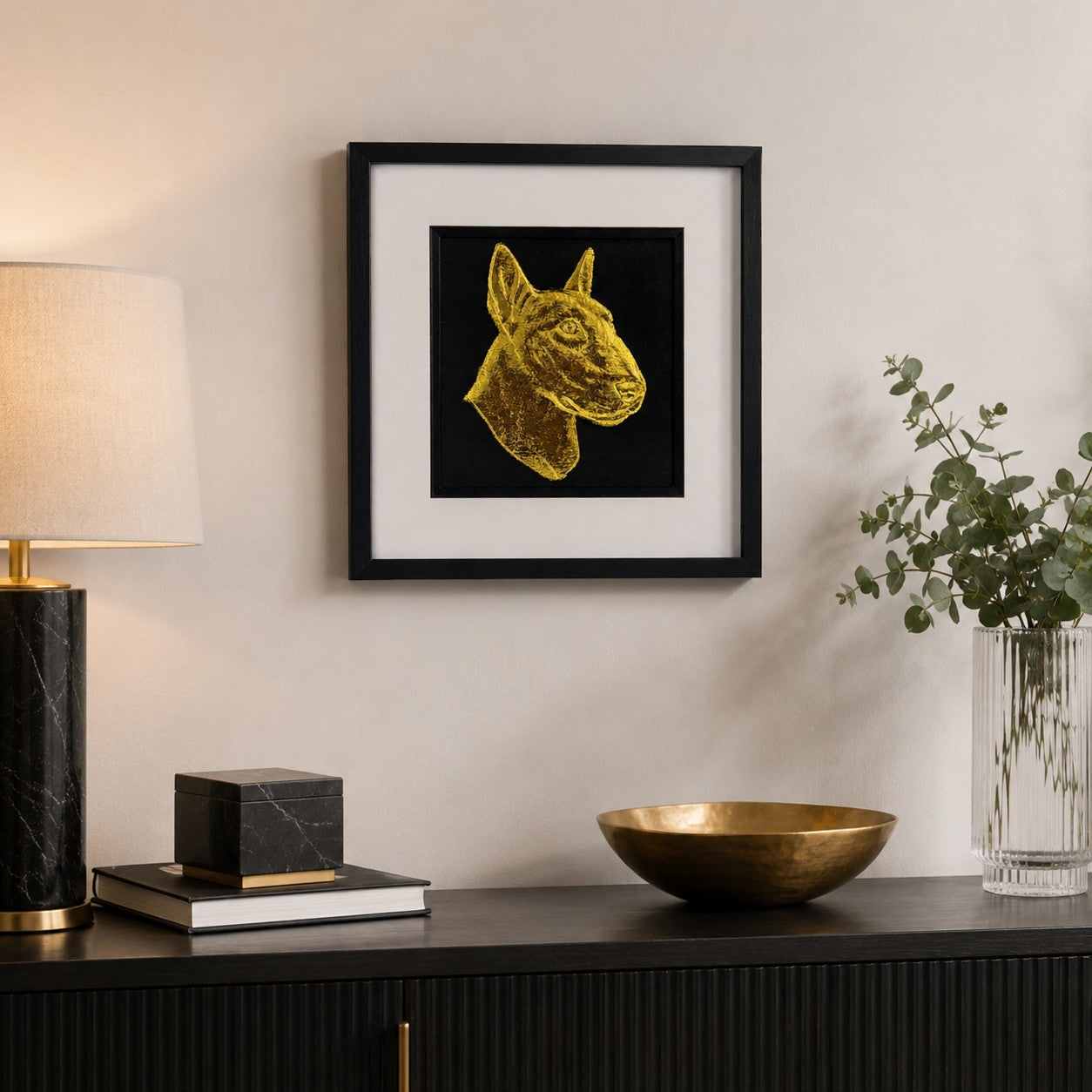 English Bull Terrier gold 3D wall art in black frame, luxury dog portrait displayed in modern home interior above black console table, handmade pet memorial décor.