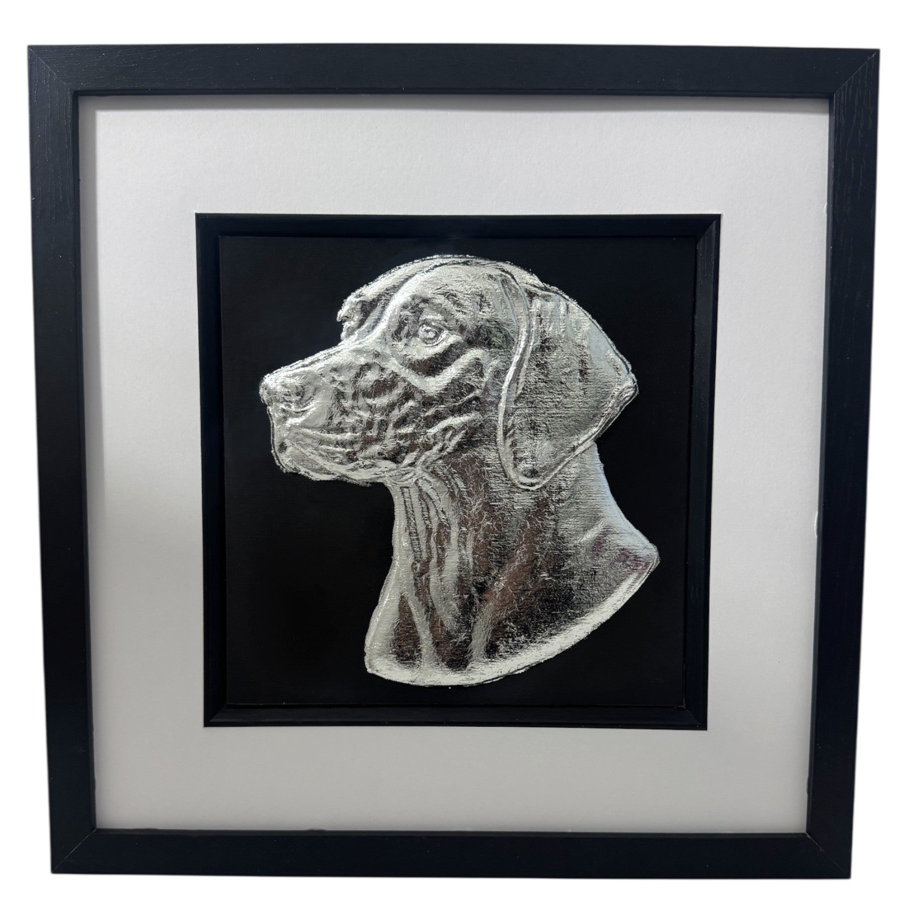 English Pointer framed wall art showing a sculpted dog portrait in silver leaf, set on a black background with white mount and black wooden frame
