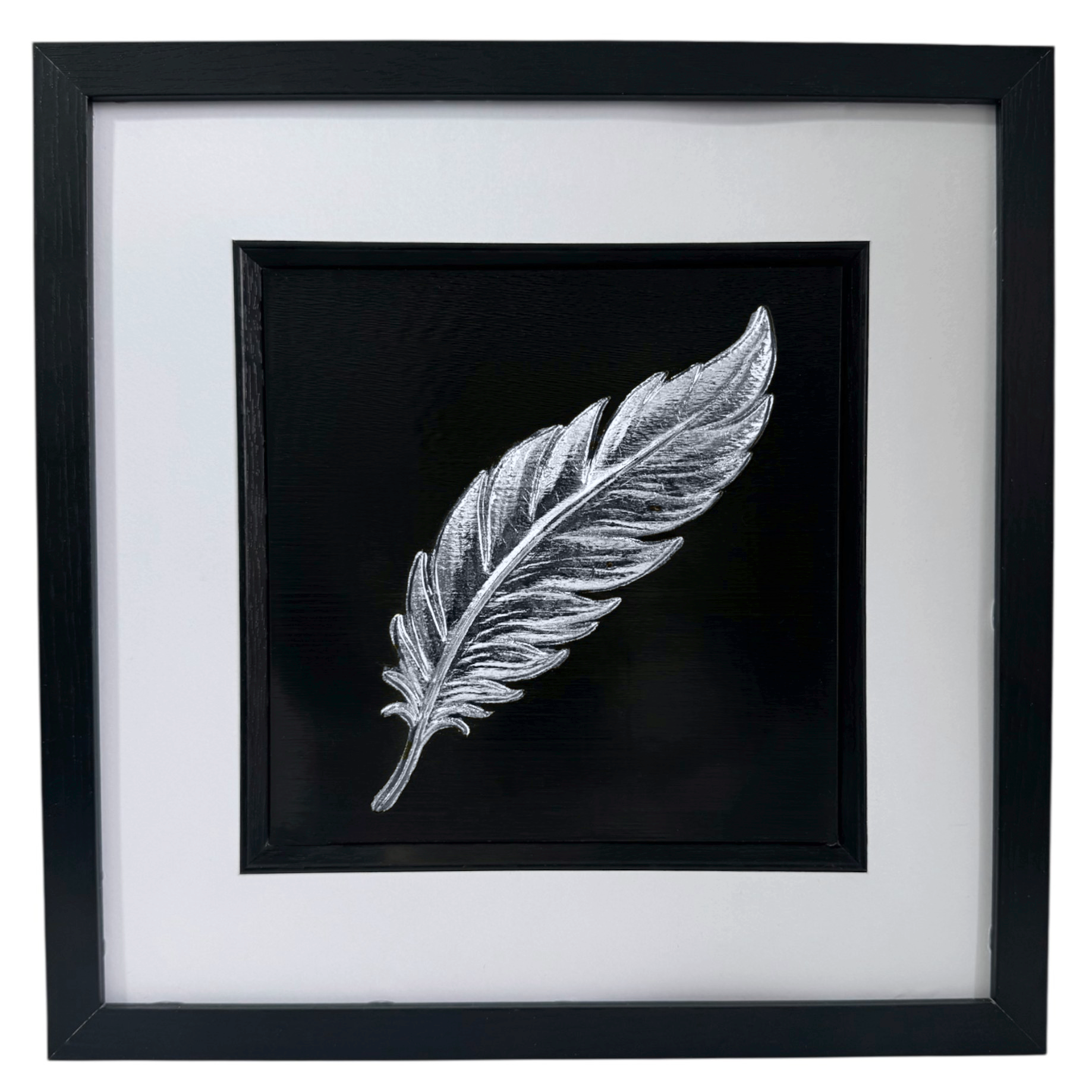 Silver leaf floating feather wall art in black wooden frame