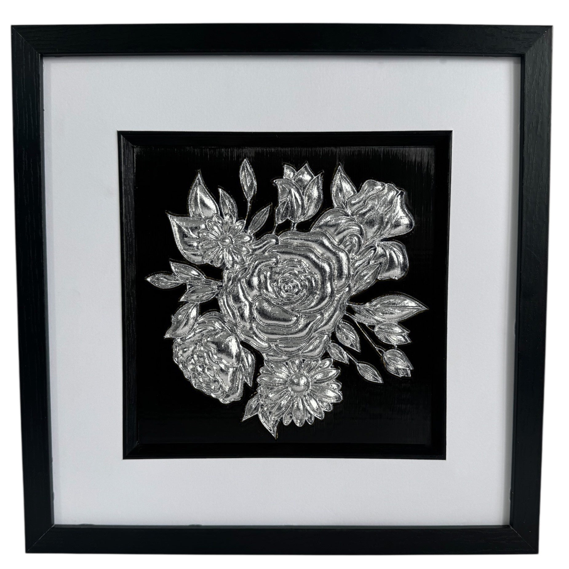 Front view of framed silver-finish floral bouquet relief with wide white mount, black inner surround, and black box frame.