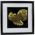 Gold 3D relief wall art of football boot striking a ball.