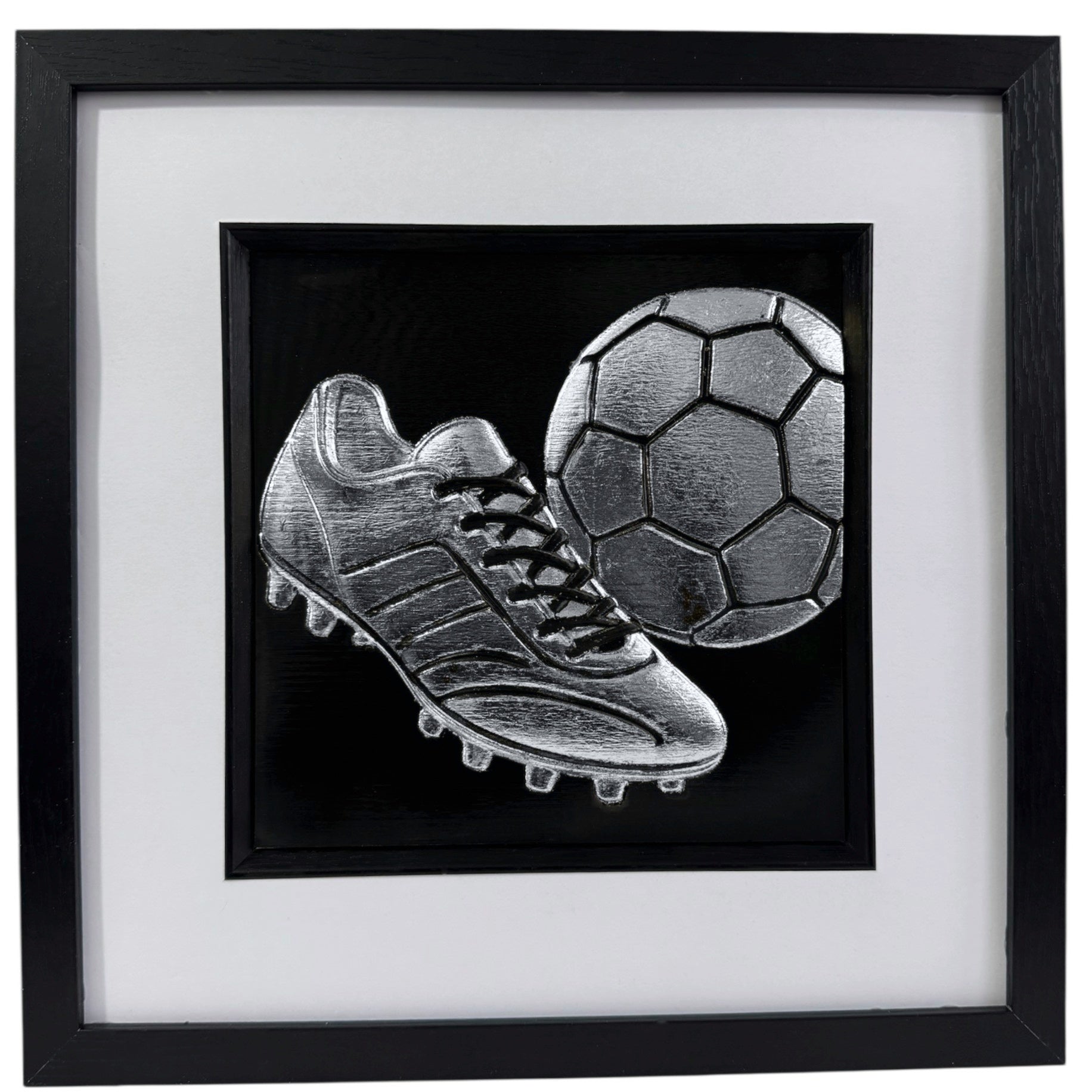 Silver 3D relief wall art of classic football boot and soccer ball.