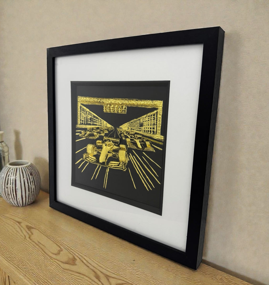 The F1 Grid art piece displayed on a wooden sideboard, perfect for an executive office or motorsport fan's display shelf.