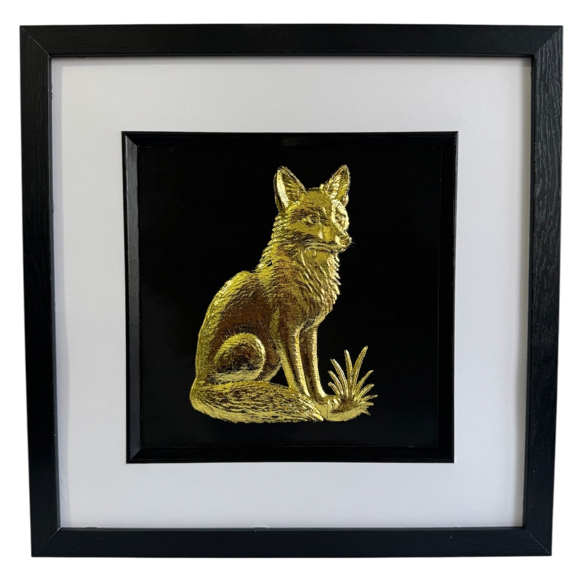 Fox framed wall art finished in gold leaf with black frame and white mount