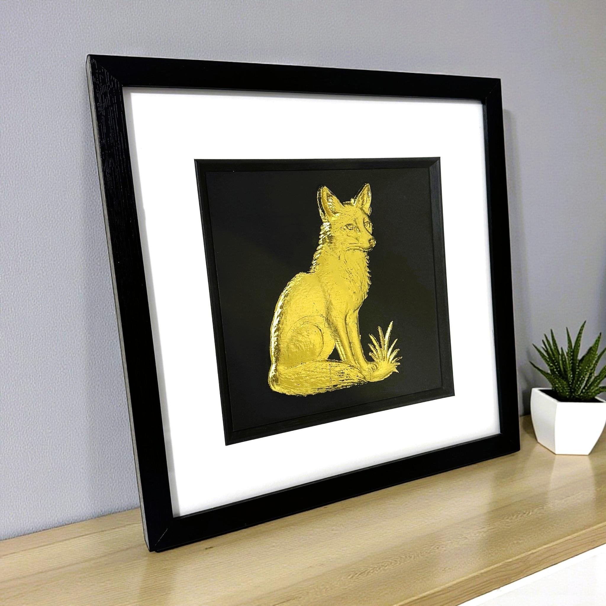 Gold leaf fox wall art centred on black background in framed display
