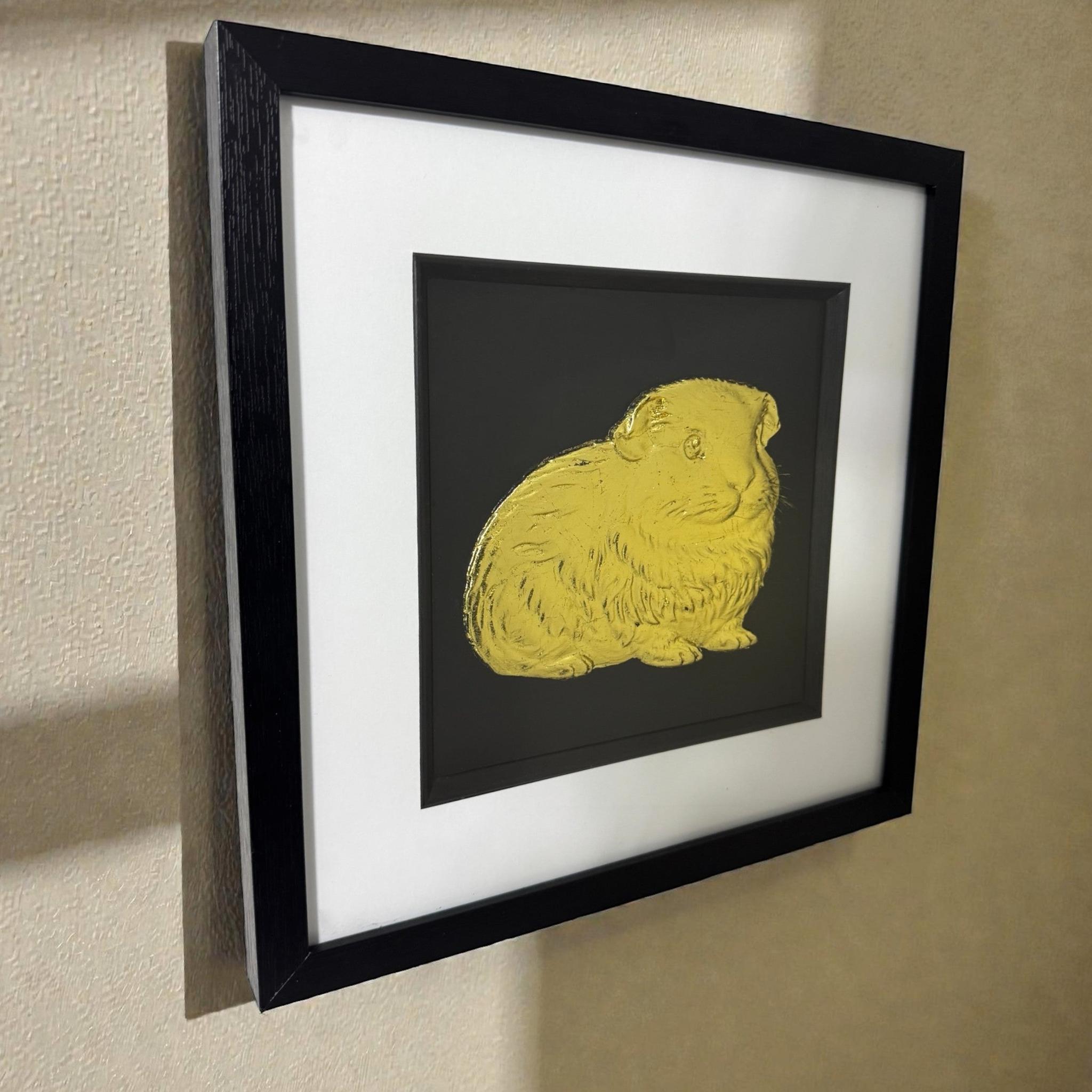 Side angle view of the Guinea Pig wall art hanging on a wall, highlighting the physical depth of the 3D relief sculpture and the gallery-style frame.
