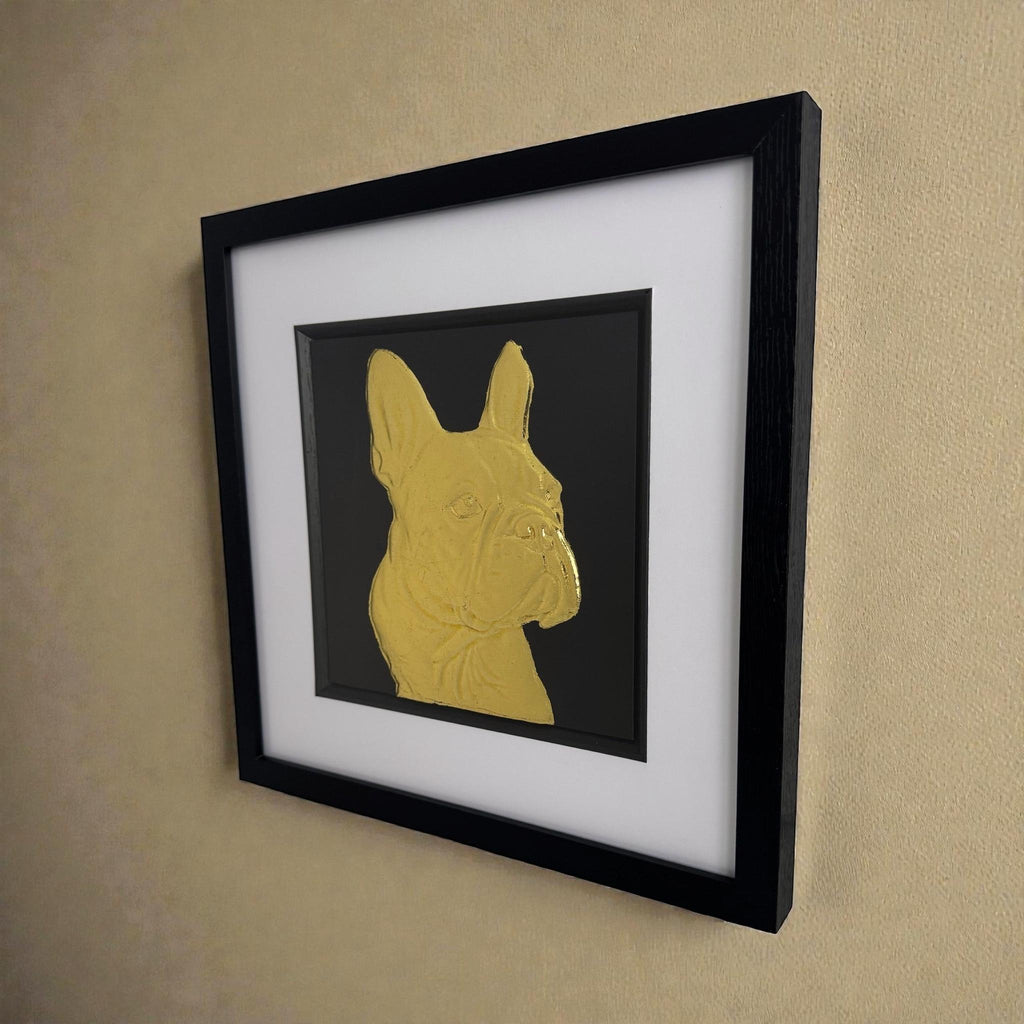 Angled view of gold French Bulldog framed 3D wall art on wall, premium dog artwork with gold leaf relief in black frame
