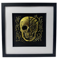 Futuristic half mechanical skull wall art in gold leaf on black background