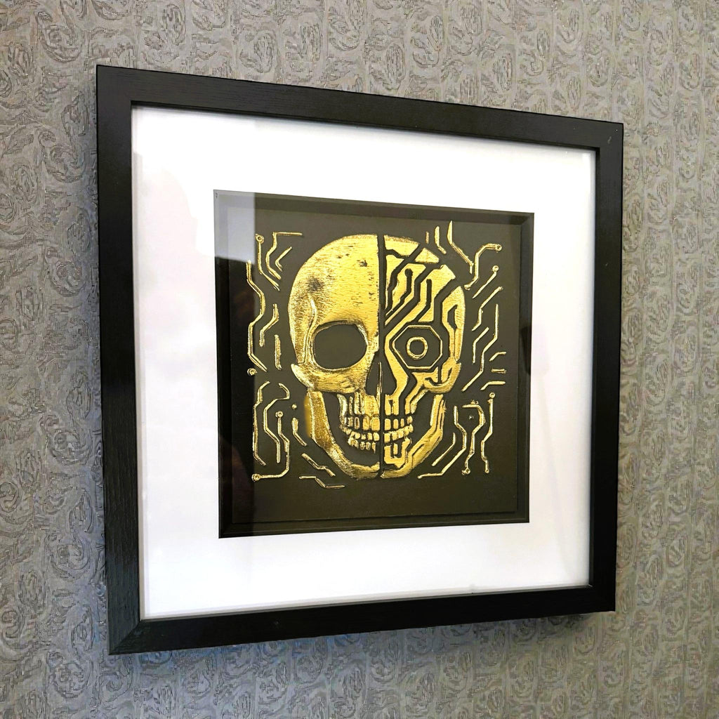 Framed futuristic skull wall art showing half human half mechanical design on wall
