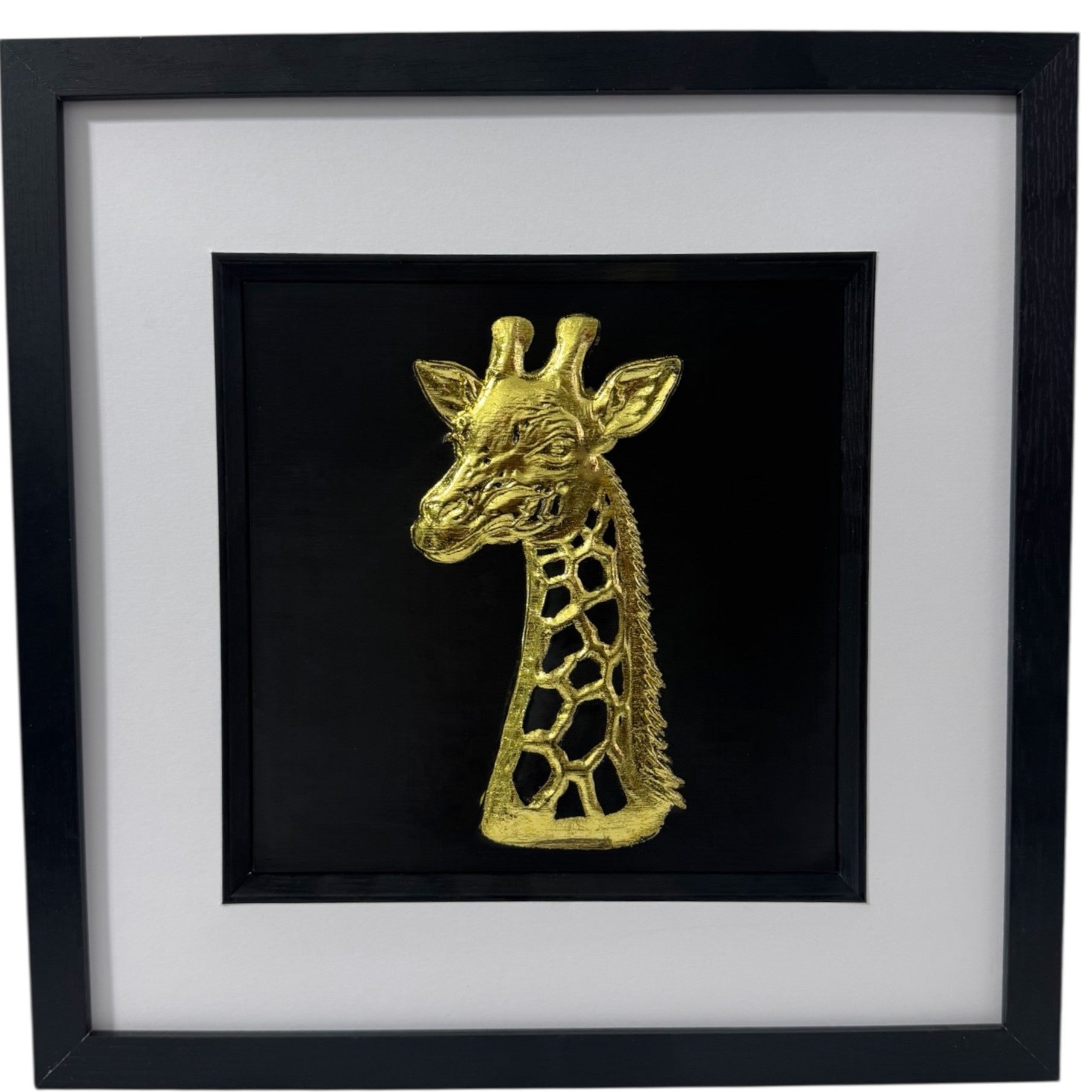Giraffe wall art framed 3D relief in gold leaf on a deep black background with white mount, black and gold wall art.