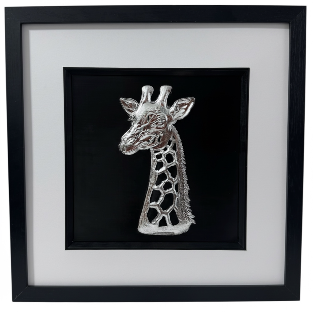 Framed 3D giraffe wall art in silver leaf on black background with white mount, modern safari wall decor.