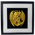 Framed gold angel and demon gothic 3D wall art with split face design, black background, white mount and black frame.