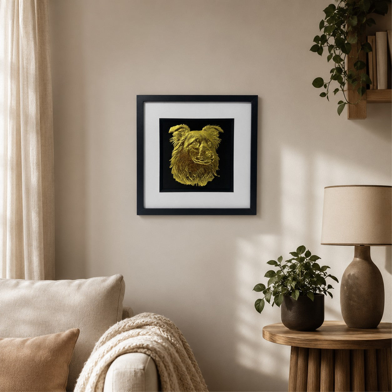 Gold Border Collie 3D wall art in a black frame displayed on a warm neutral living room wall with soft textiles, natural wood and greenery