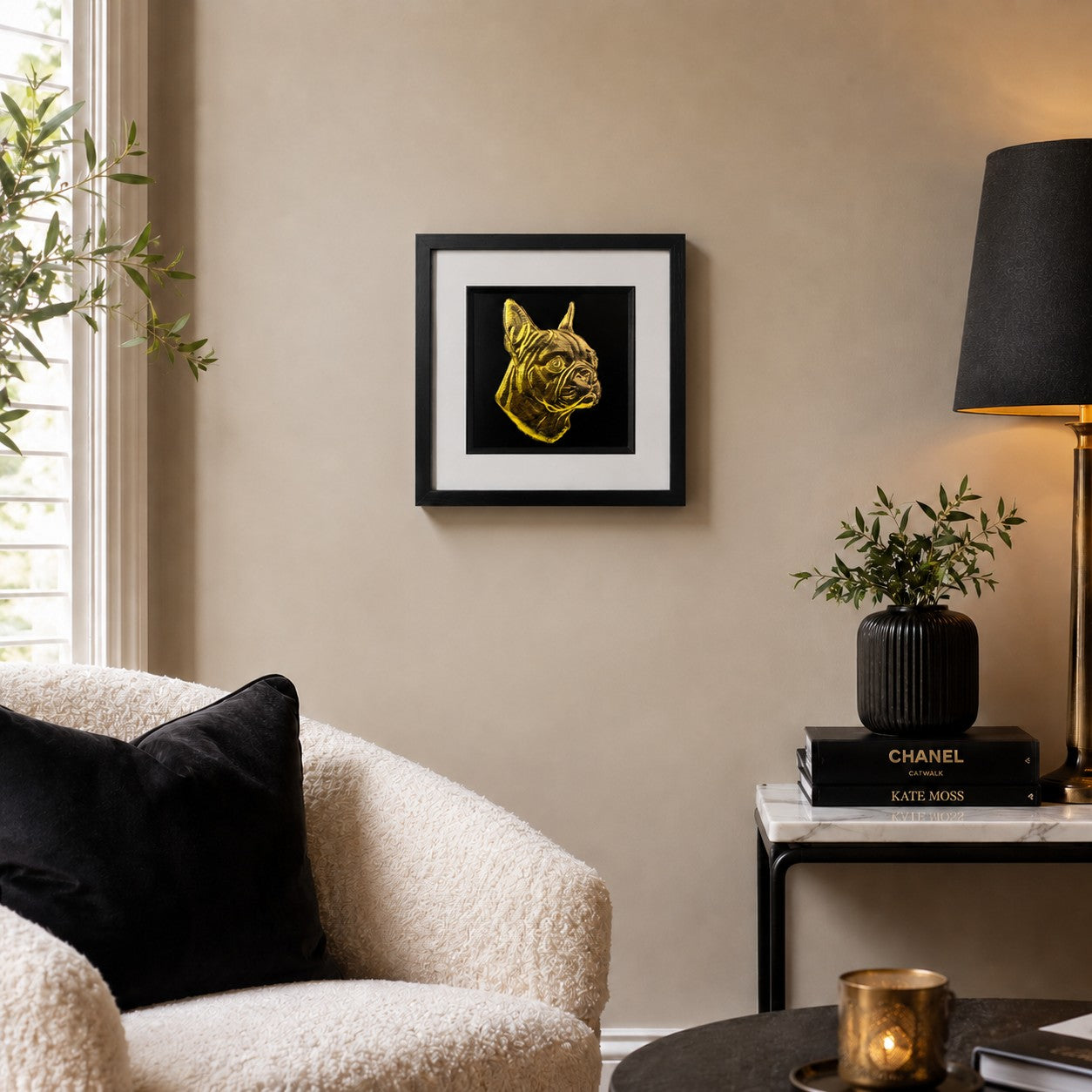 Gold Boston Terrier 3D wall art in a black frame displayed on a warm neutral living room wall with soft seating, black accents and modern decor.