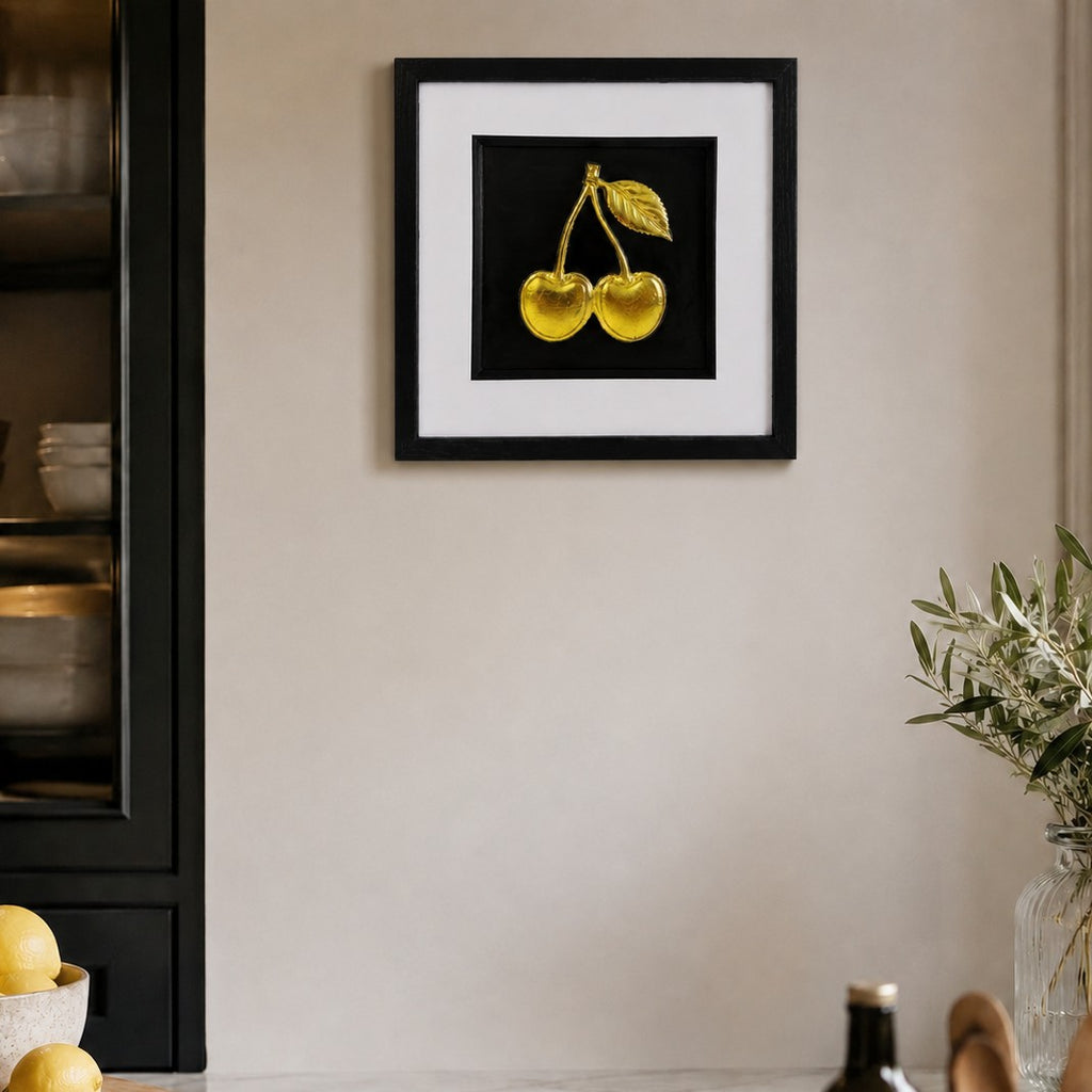 Gold cherry 3D framed artwork styled in a warm kitchen with black box frame and wide white mount.