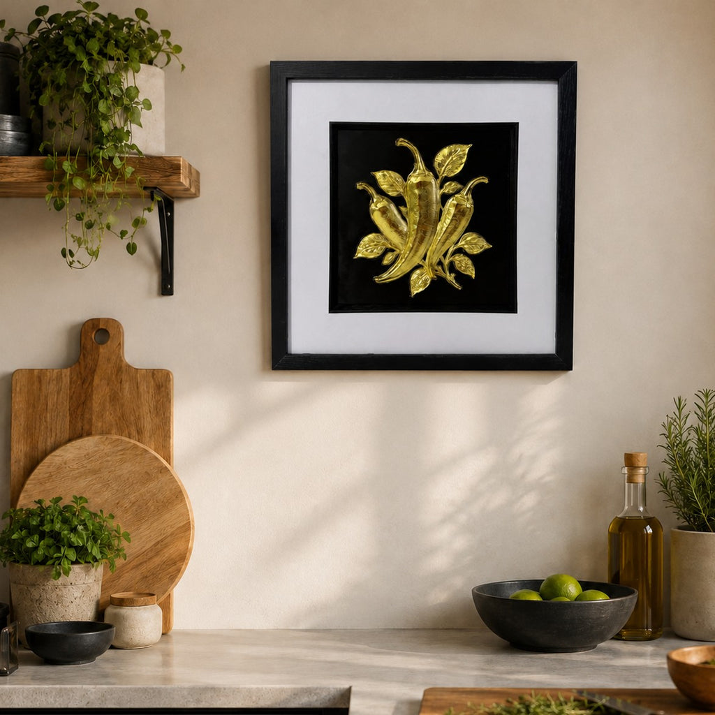 Gold chilli pepper framed 3D artwork in a warm kitchen with herbs, garlic and wood styling.